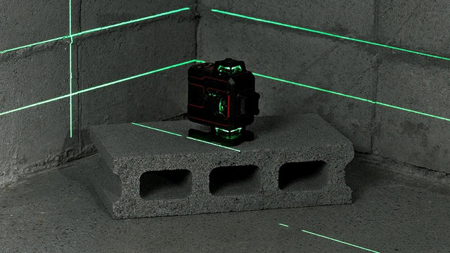VADER 4D projecting green 360 degree laser lines into a room corner