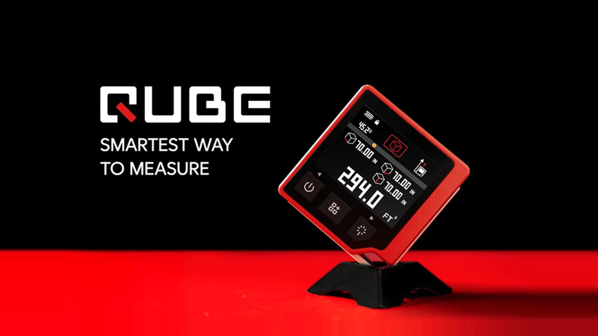 QUBE 3-in-1 digital angle finder, level and laser distance meter on a red stand