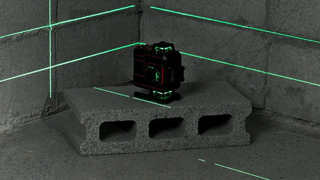 VADER 4D projecting green 360 degree laser lines into a room corner